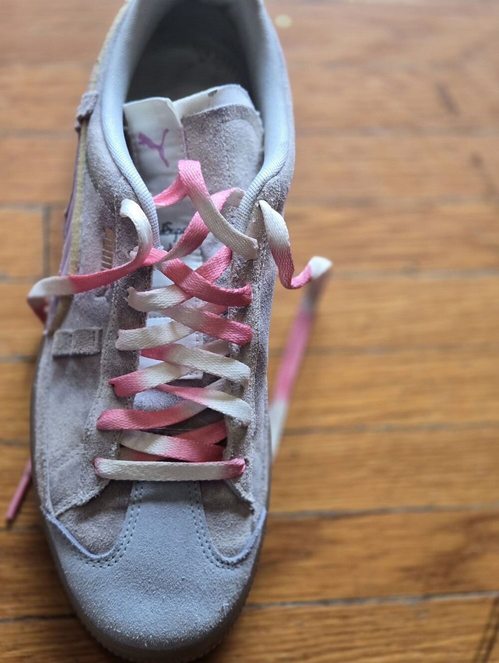 Puma Women's Suede Sneaker in Light Gray with Pink Accents
